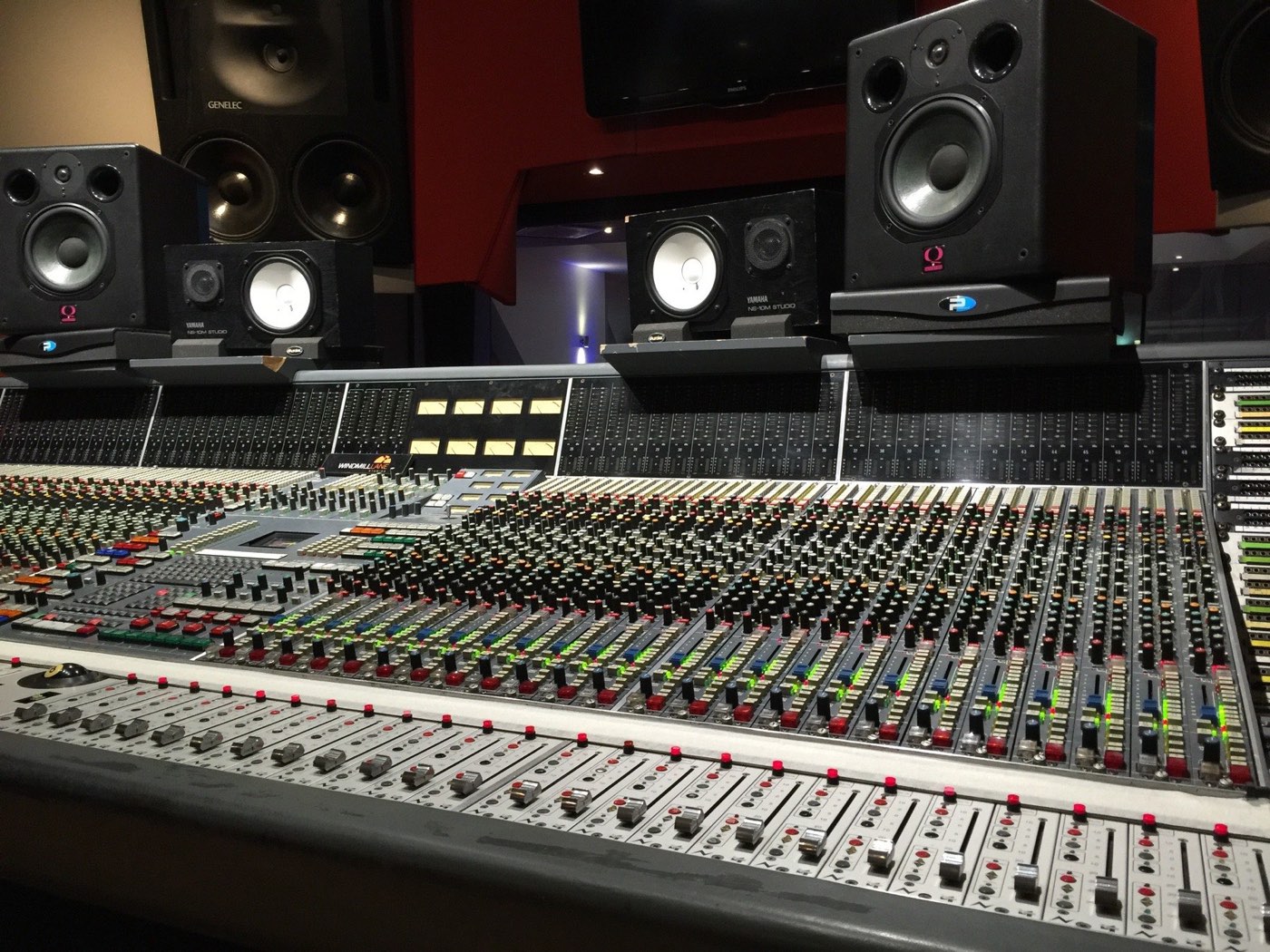 Recording studio with mixing desk and studio monitor speakers